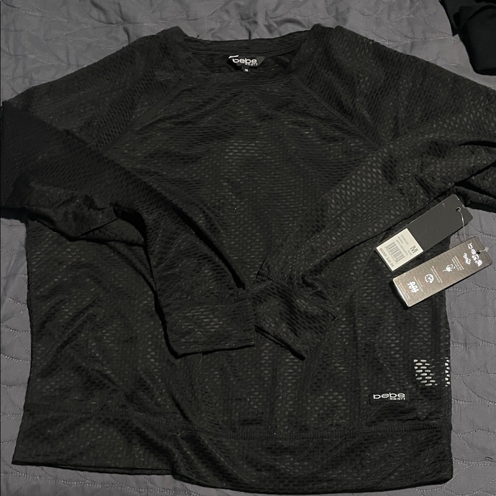 Bebe Black  Long Sleeve Top this is mesh.. very cute with colored tank under
